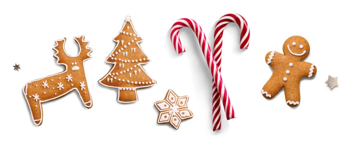 Christmas sweet food - gingerbread shaped biscuits and candy canes.